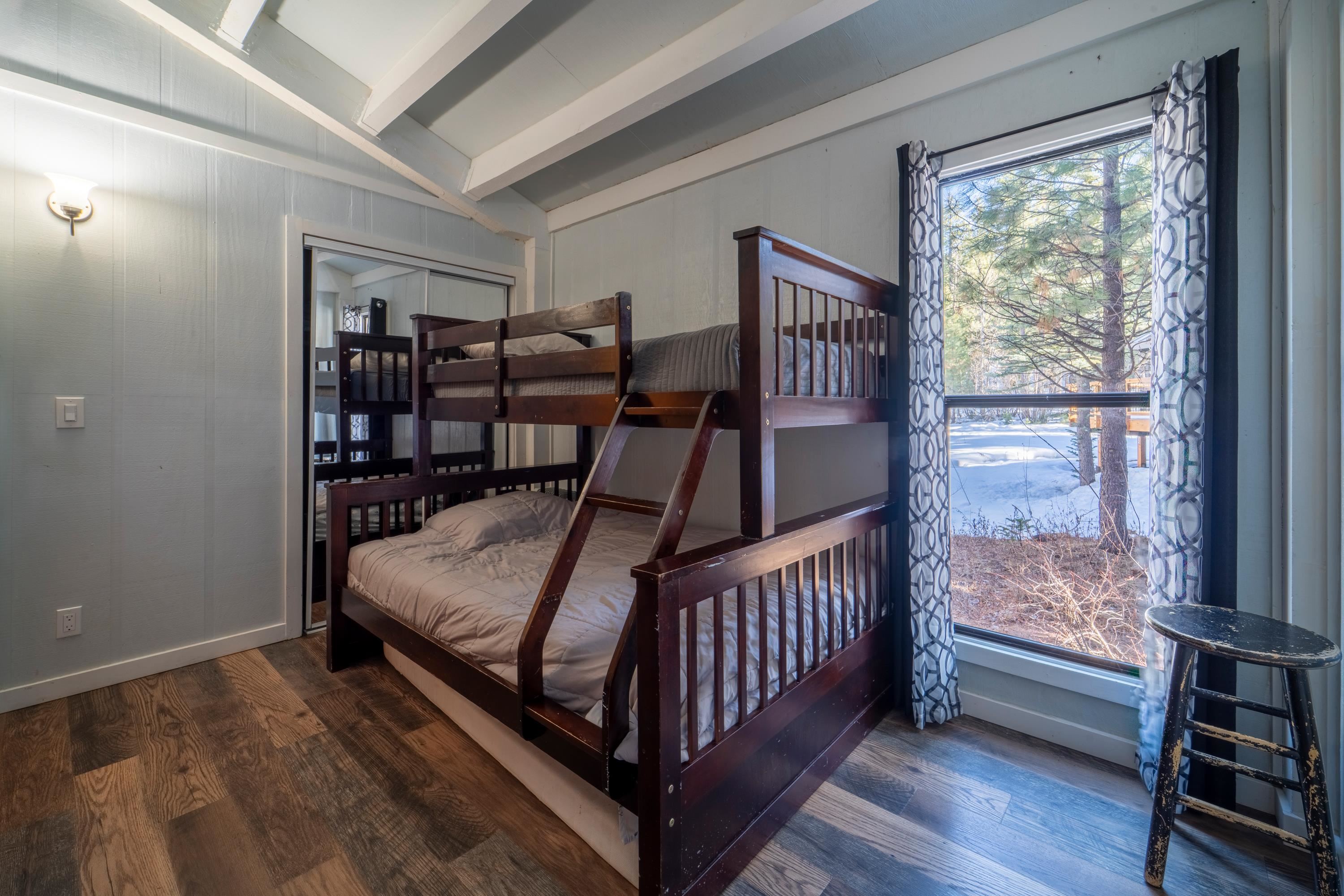842 Beaver Pond Truckee, CA 96161 - Photo 13 of 22 a bed sitting in a bedroom next to a window