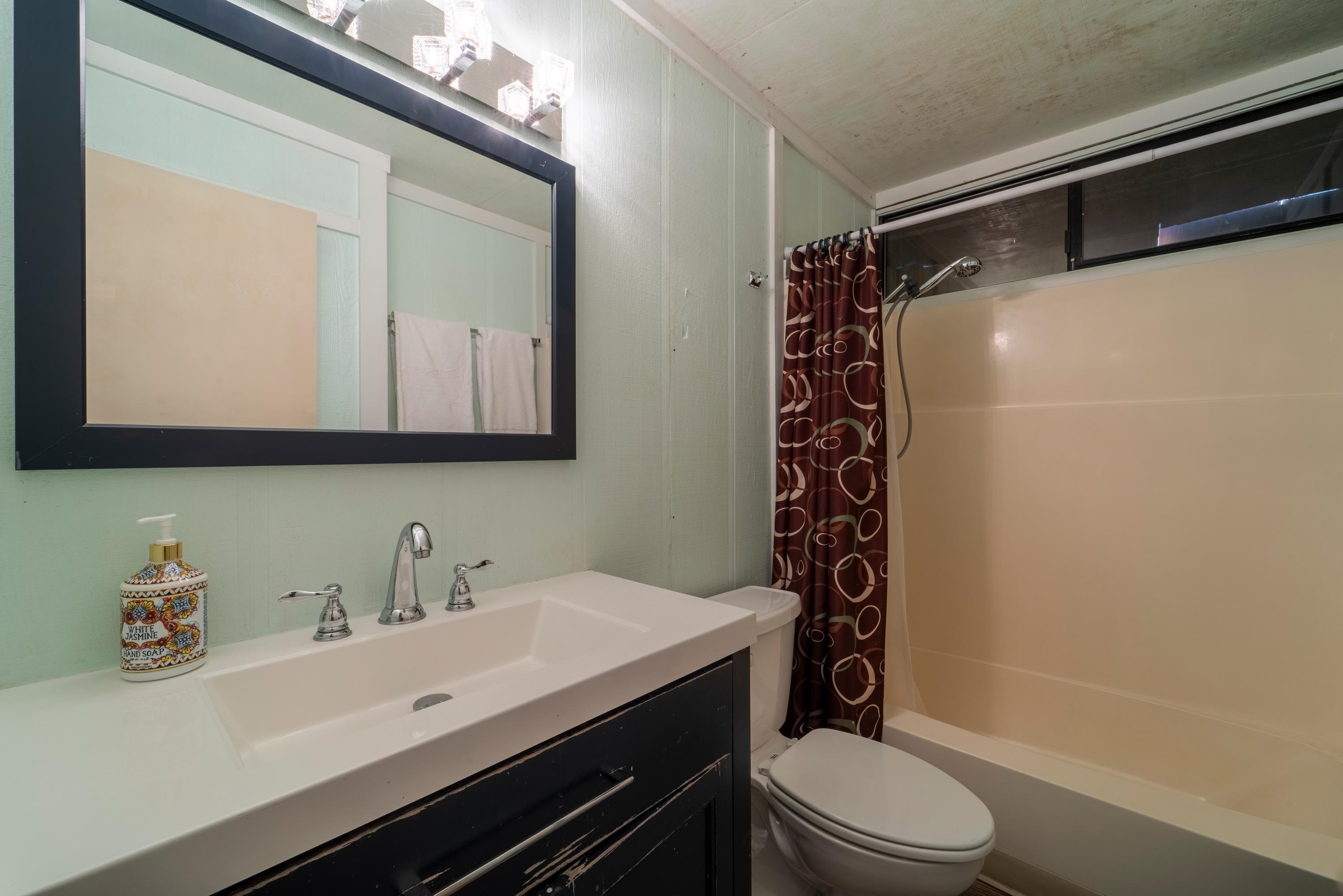 842 Beaver Pond Truckee, CA 96161 - Photo 14 of 22 a bathroom with a sink a toilet and shower