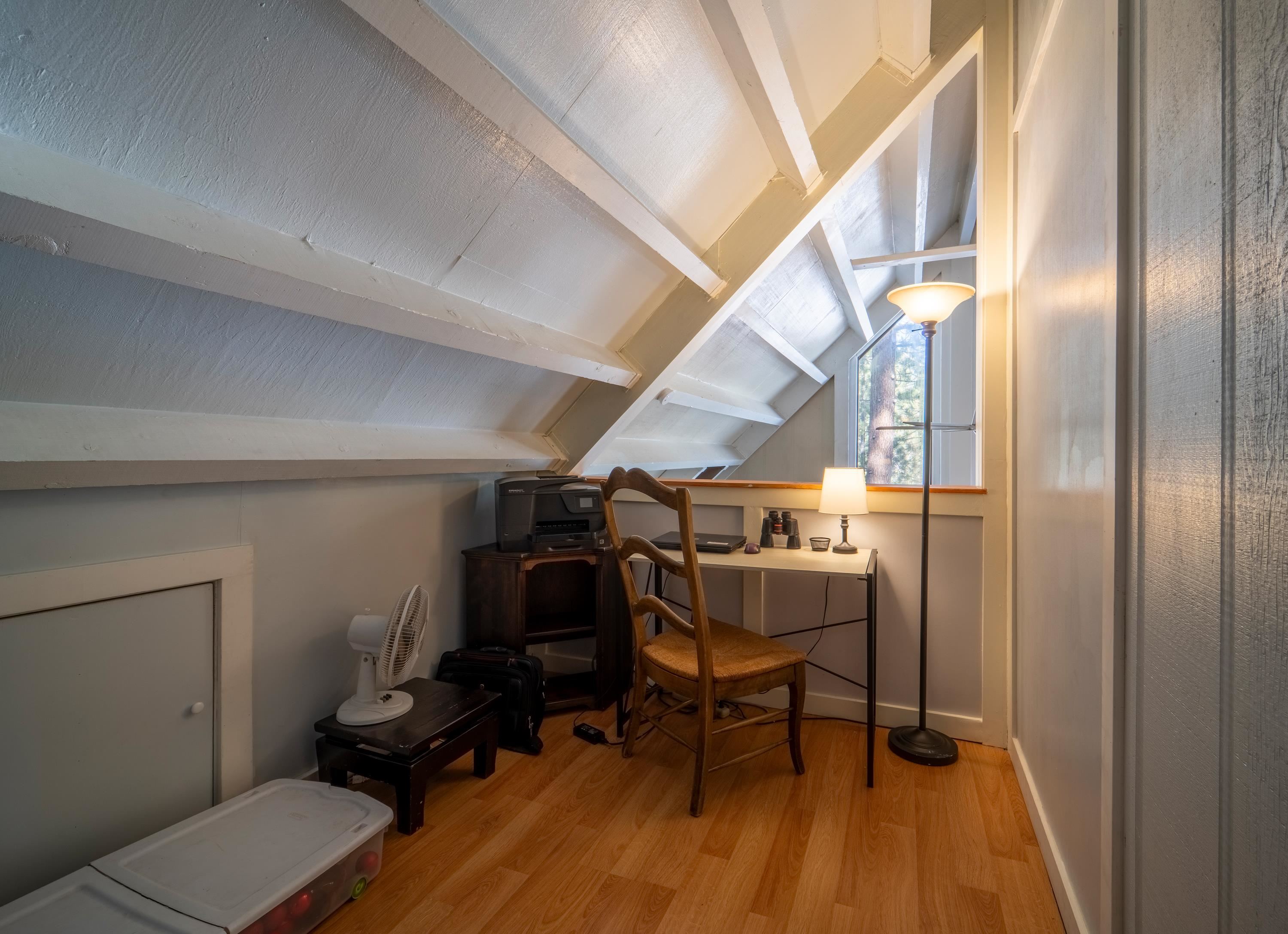 842 Beaver Pond Truckee, CA 96161 - Photo 16 of 22 a view of a room with chairs and wooden floor