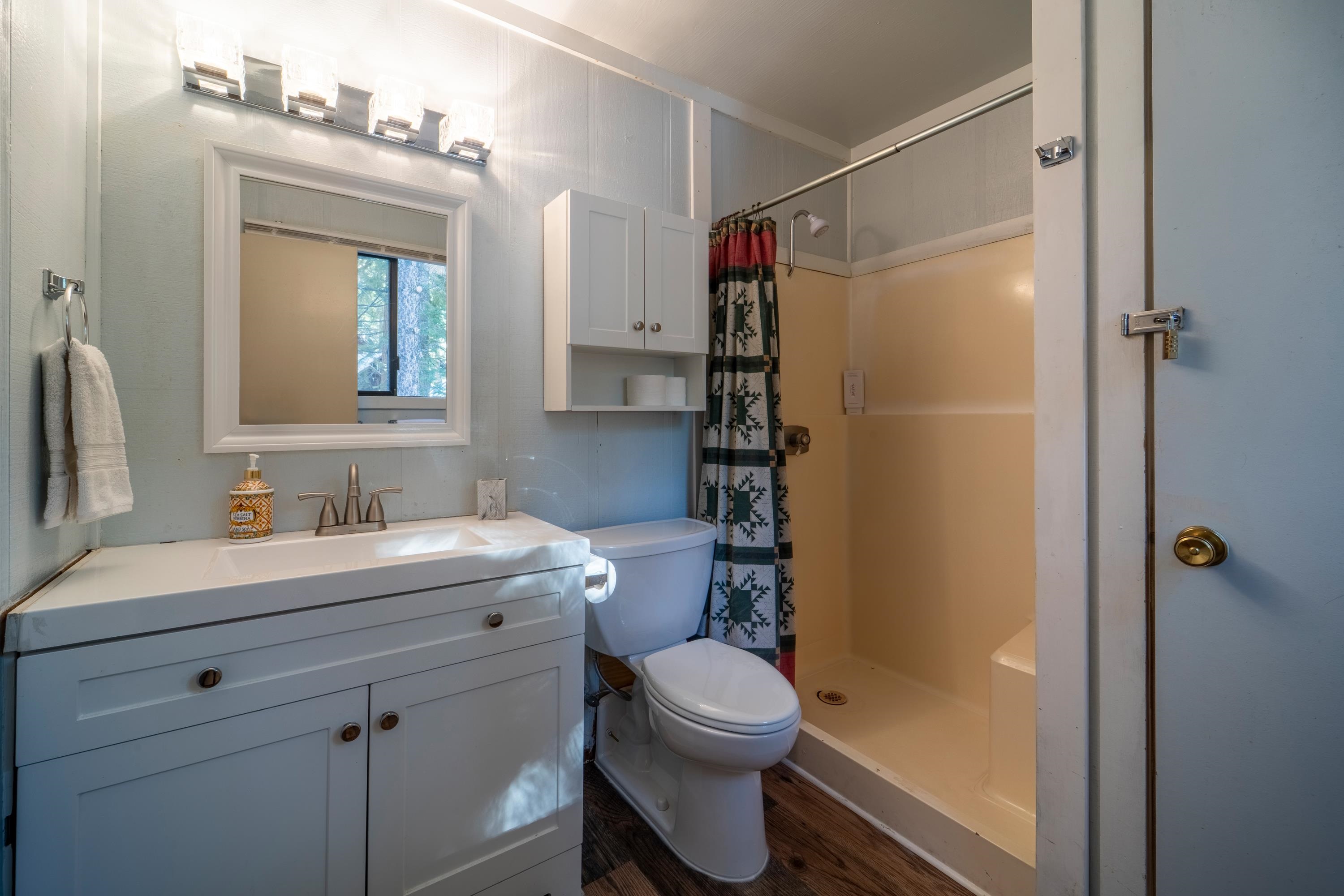 842 Beaver Pond Truckee, CA 96161 - Photo 18 of 22 a bathroom with a sink a toilet and shower