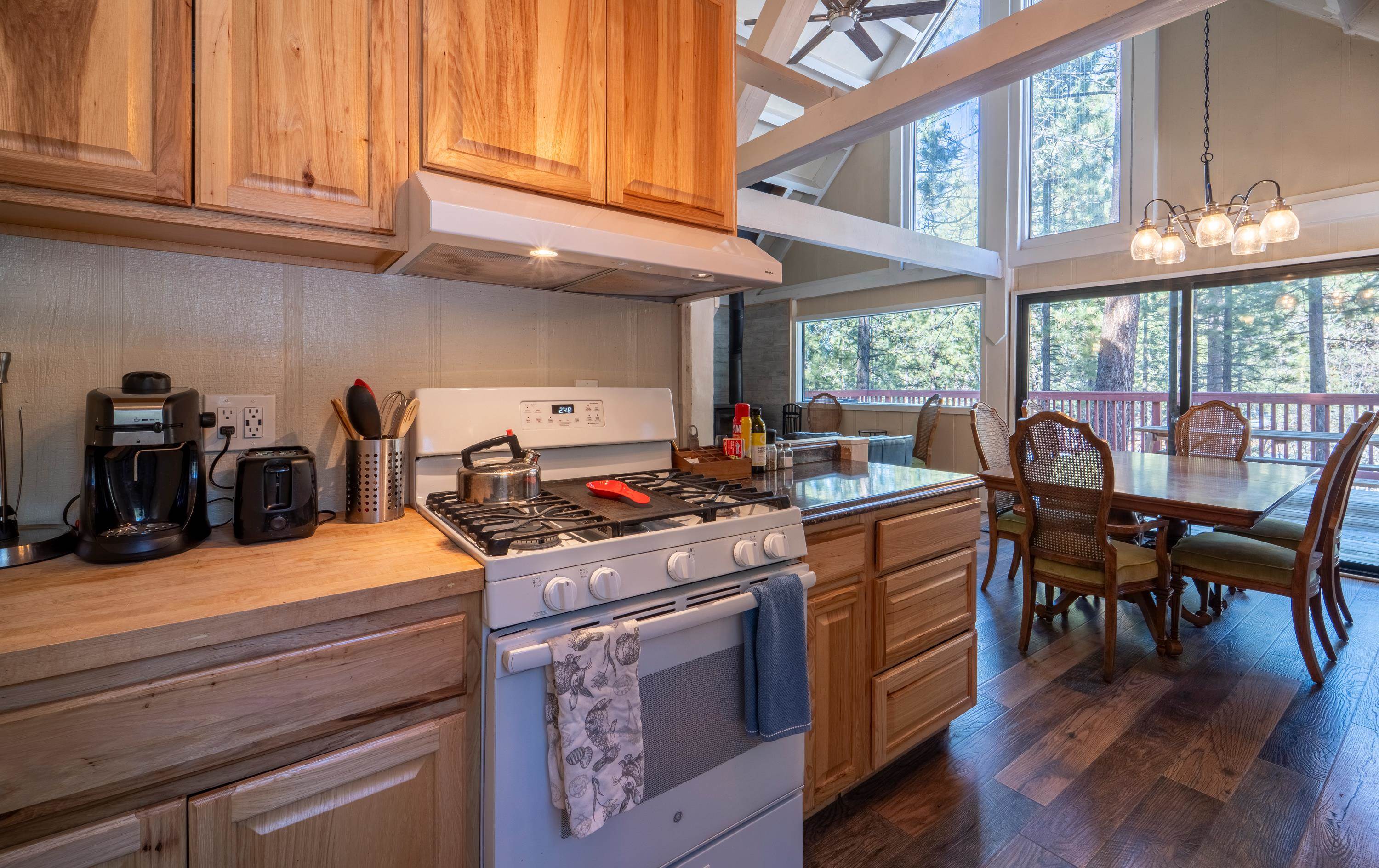 842 Beaver Pond Truckee, CA 96161 - Photo 6 of 22 a kitchen with stainless steel appliances granite countertop a stove and cabinets