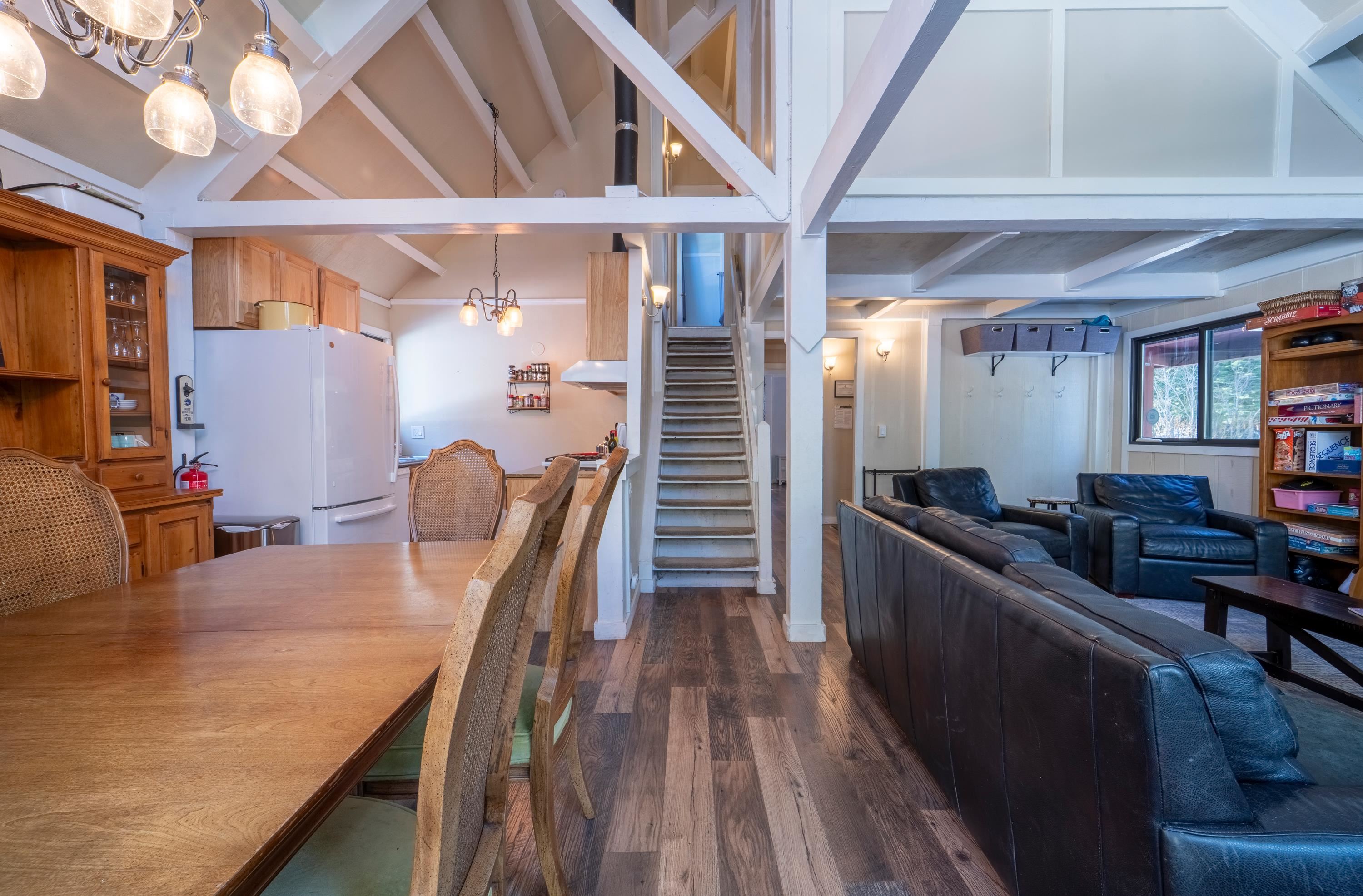 842 Beaver Pond Truckee, CA 96161 - Photo 7 of 22 a view of a dining room with furniture window and wooden floor