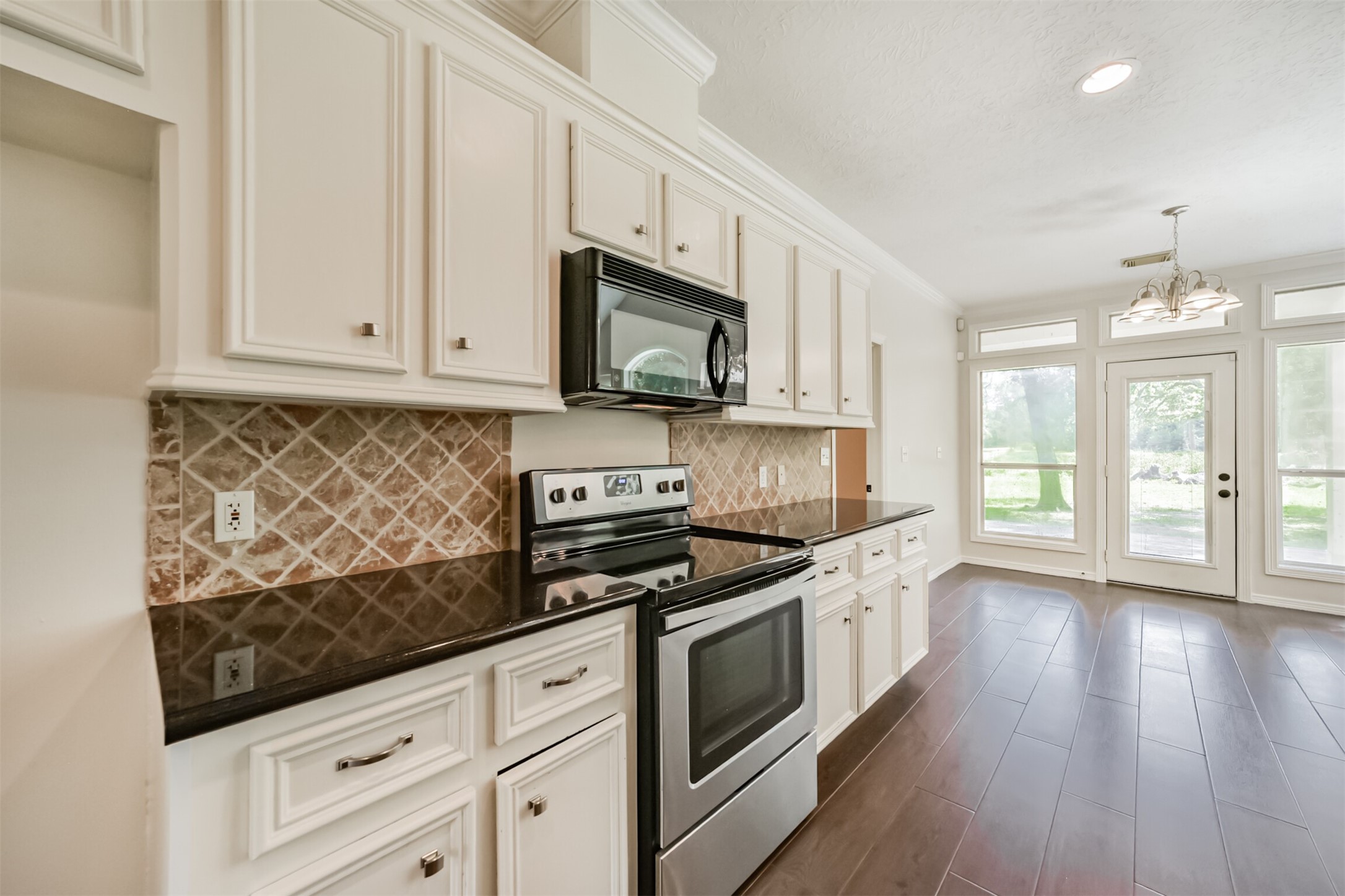 27322 Afton Way Huffman, TX 77336 - Photo 21 of 50 Spacious kitchen offers abundant cabinetry, expansive prep space, and a bright breakfast area overlooking the backyard.