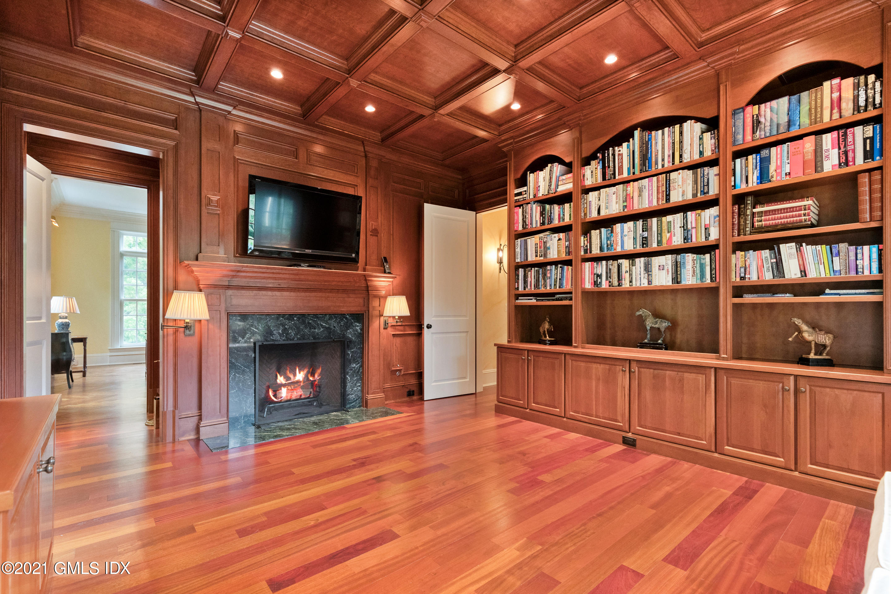 55 Perkins Road Greenwich, CT 06830 - Photo 12 of 38 a living room with hard wood floors and a fireplace