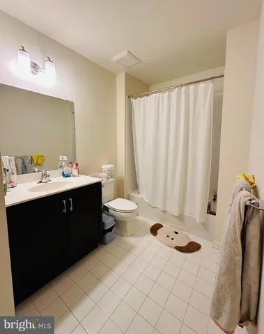 a bathroom with a double vanity sink and mirror