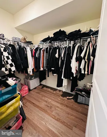 wooden floor with shoes and chairs