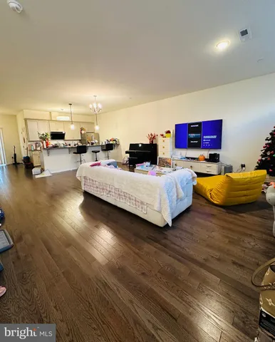 a bedroom with furniture and a book shelf