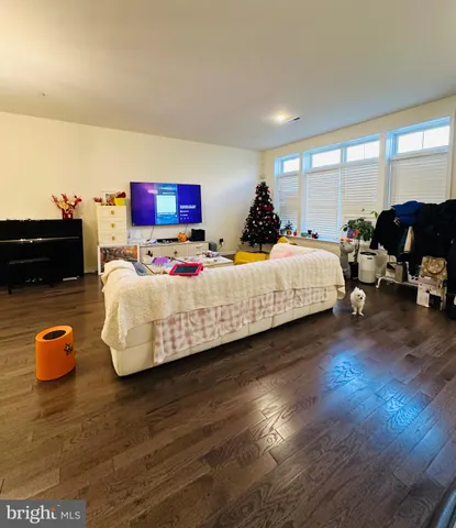 a bedroom with bed and a couch