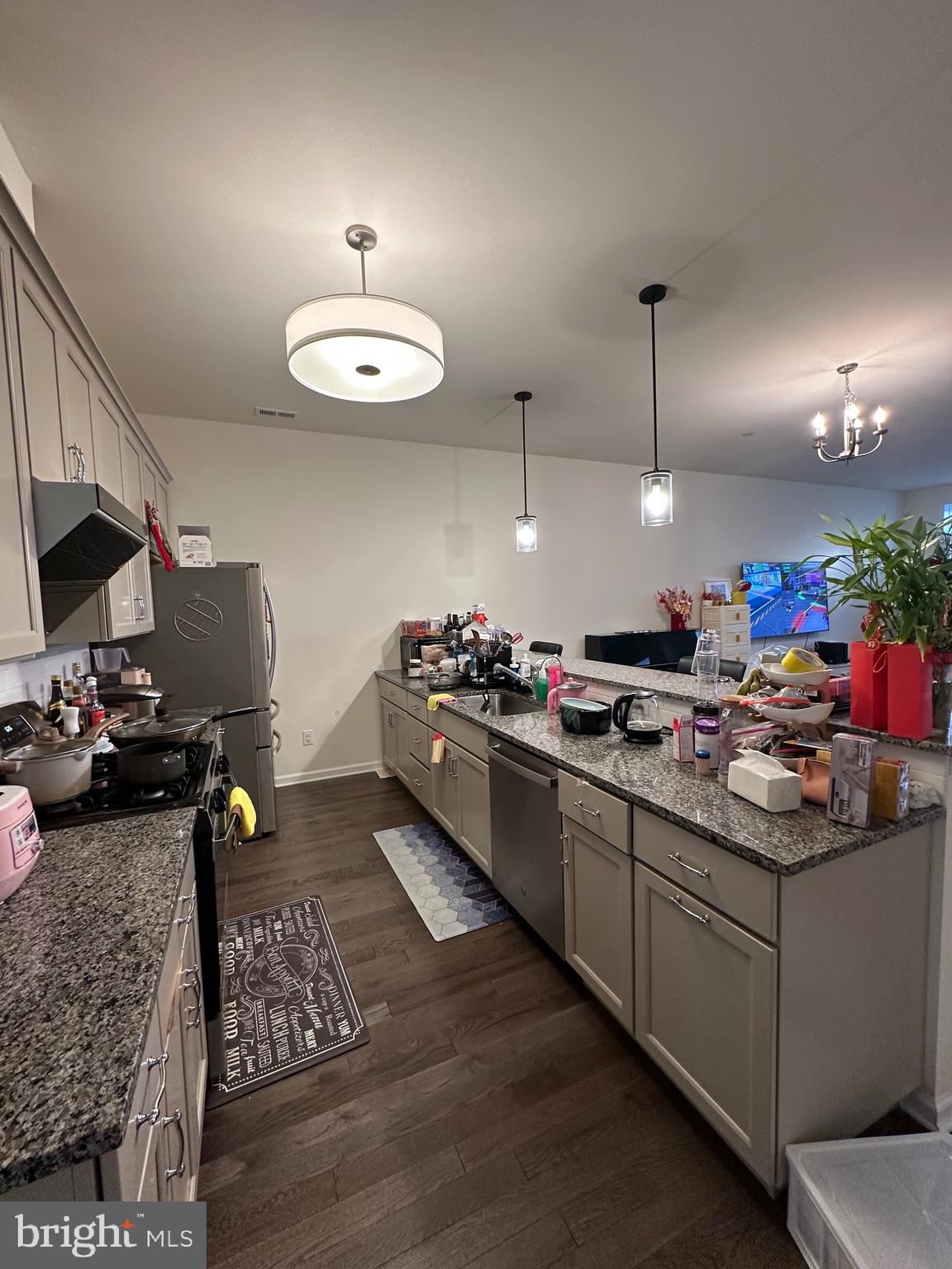 3408 Pietro Way Philadelphia, PA 19145 - Photo 8 of 21 a kitchen that has a lot of cabinets a sink and a stove in it