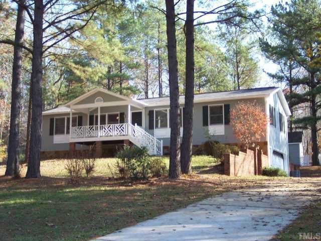 3417 High Gate Road Raleigh, NC 27603 - Photo 1 of 1 a front view of a house with a yard table and chairs
