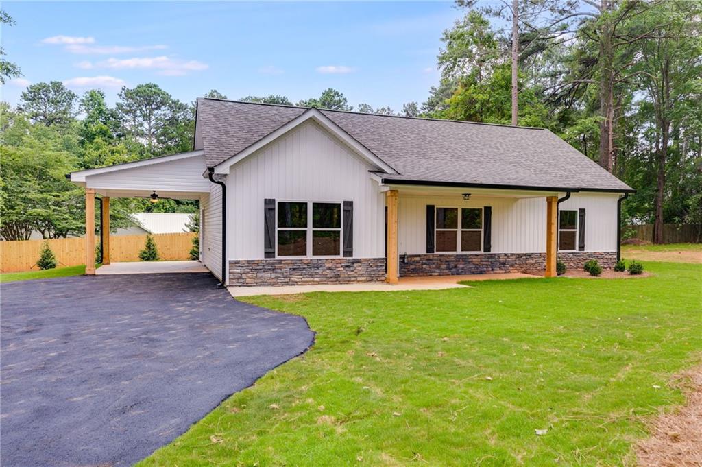 Tract4 Dunn Road Silver Creek, GA 30173 - Photo 1 of 1 a view of a house with backyard and garden