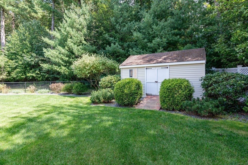 53 Queens Circle Raynham, MA 02767 - Photo 13 of 38 a view of a house with a garden