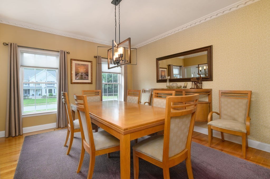 53 Queens Circle Raynham, MA 02767 - Photo 17 of 38 a view of a dining room with furniture window and wooden floor
