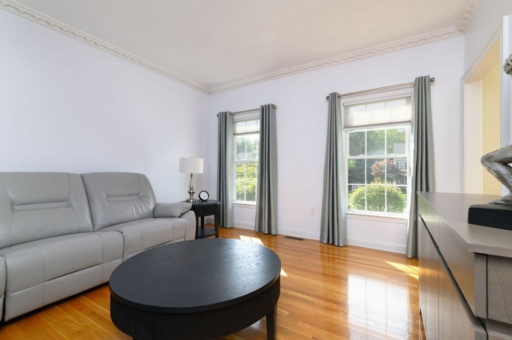 53 Queens Circle Raynham, MA 02767 - Photo 25 of 38 a living room with furniture and a large window