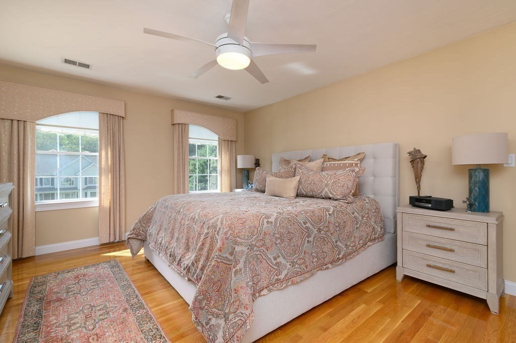 53 Queens Circle Raynham, MA 02767 - Photo 26 of 38 a bedroom with a bed and a dresser