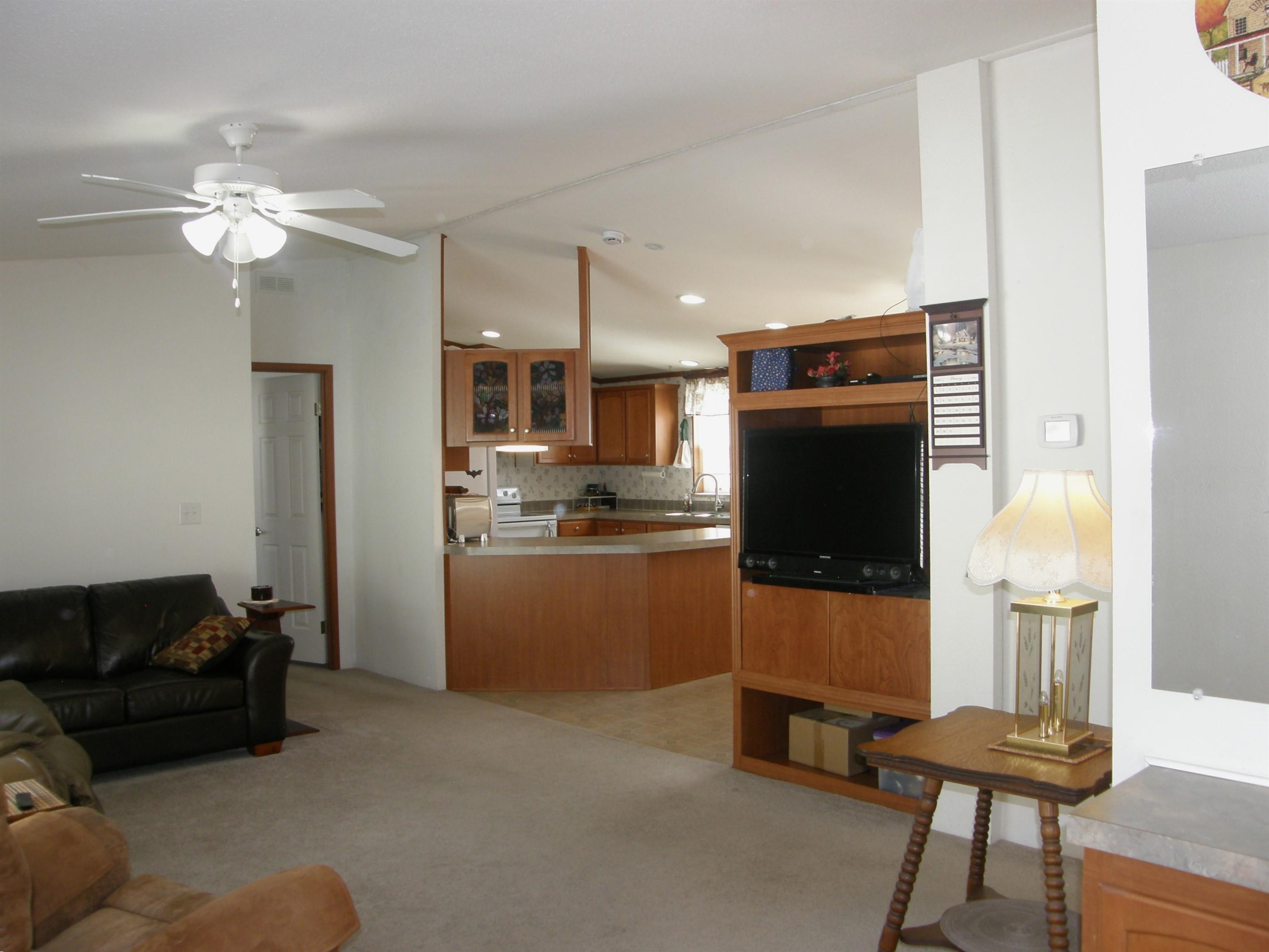 435 32 Road, Unit 262 Clifton, CO 81520 - Photo 17 of 42 a living room with furniture and a flat screen tv