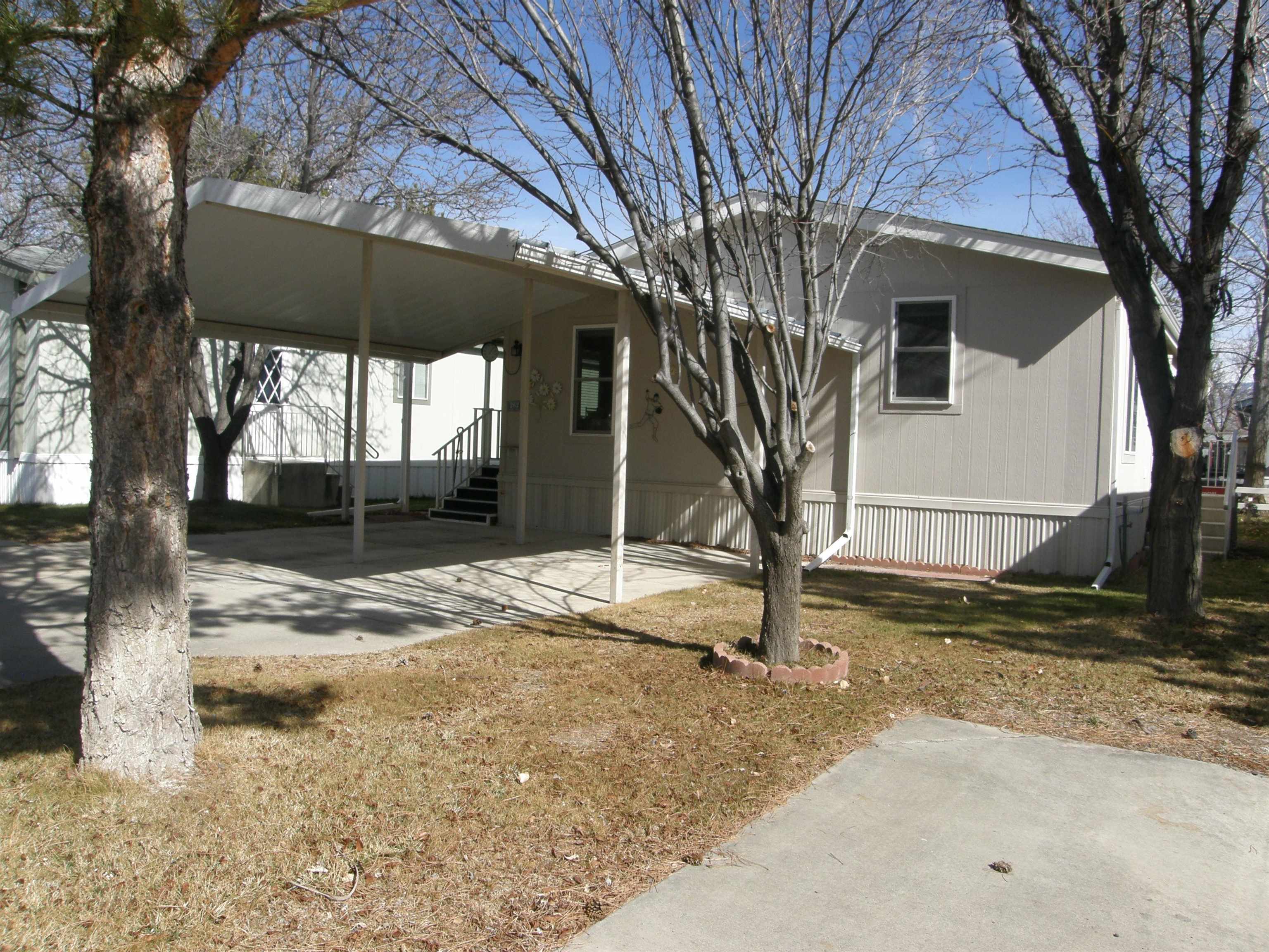 435 32 Road, Unit 262 Clifton, CO 81520 - Photo 2 of 42 a house with trees in front of it