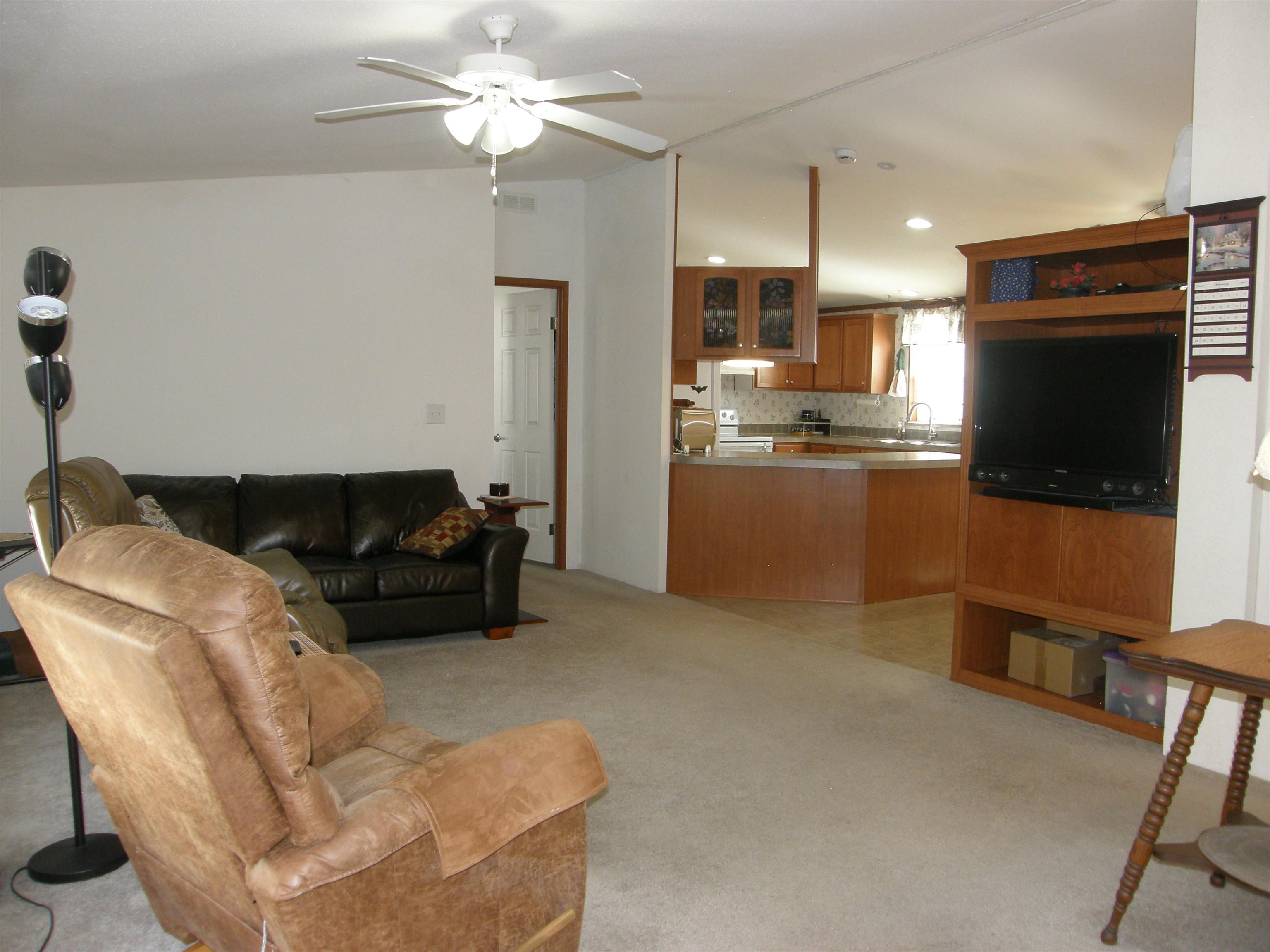 435 32 Road, Unit 262 Clifton, CO 81520 - Photo 24 of 42 a living room with furniture and a flat screen tv