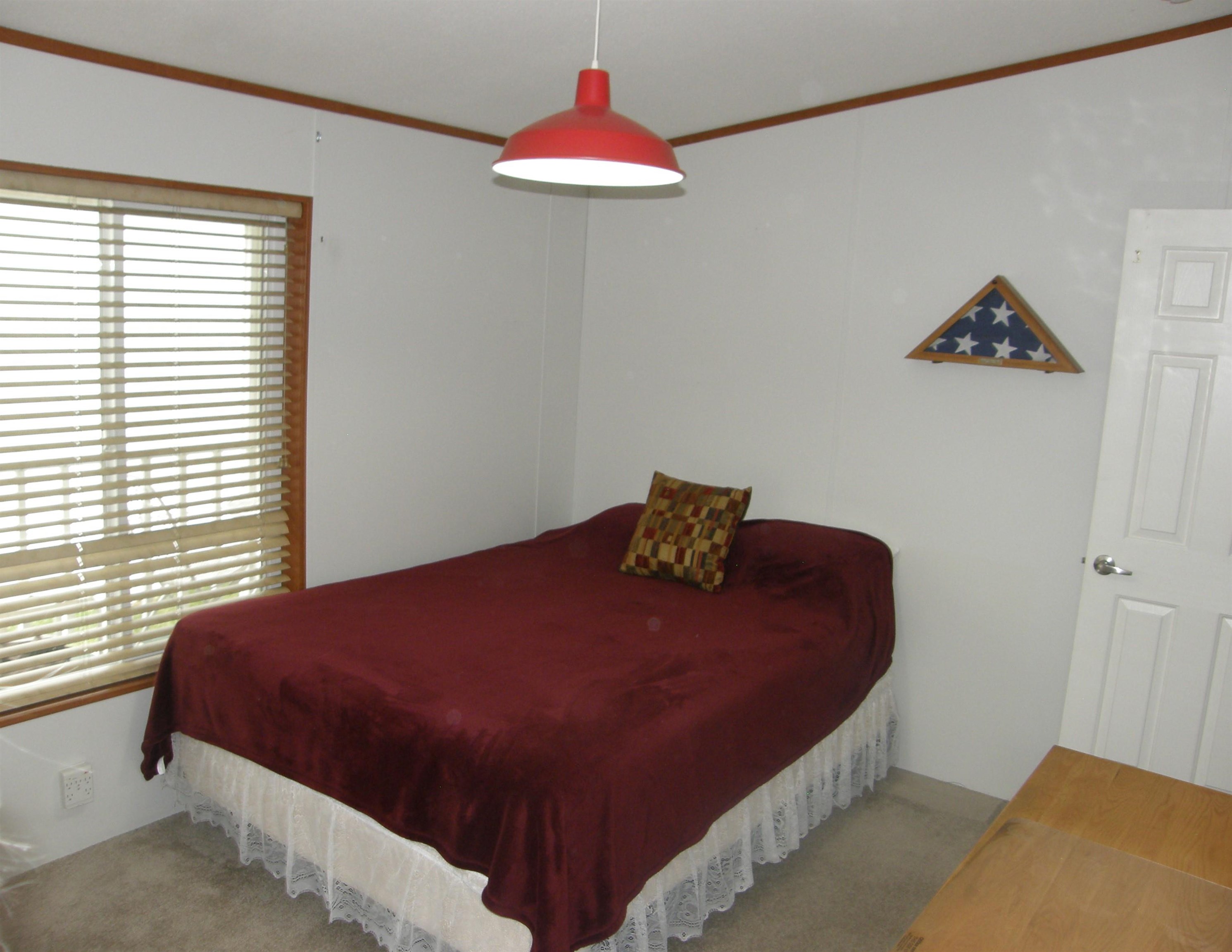 435 32 Road, Unit 262 Clifton, CO 81520 - Photo 32 of 42 a bedroom with a bed and a window