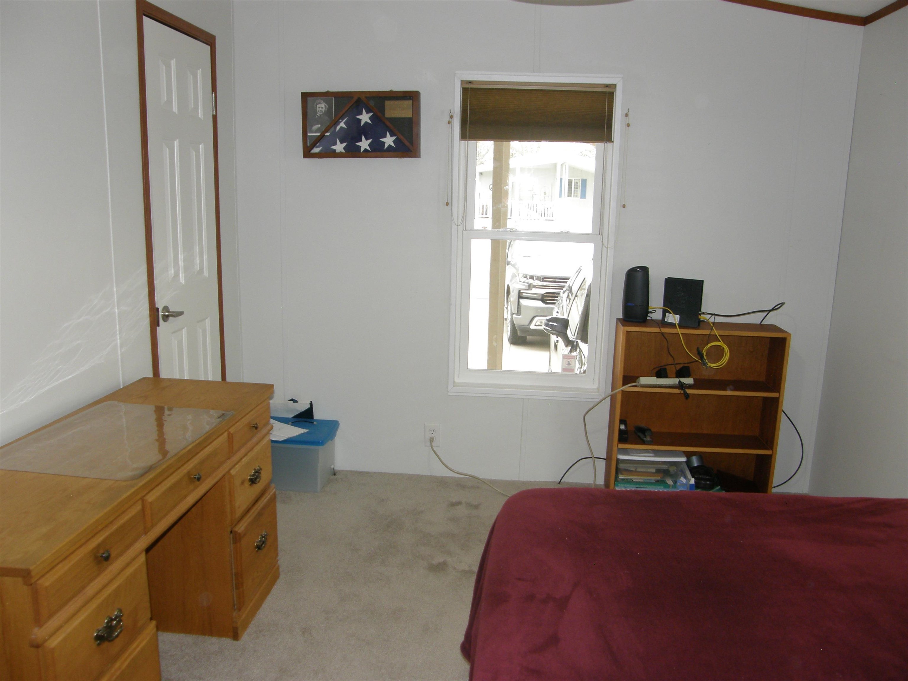 435 32 Road, Unit 262 Clifton, CO 81520 - Photo 33 of 42 a bedroom with a bed and a window