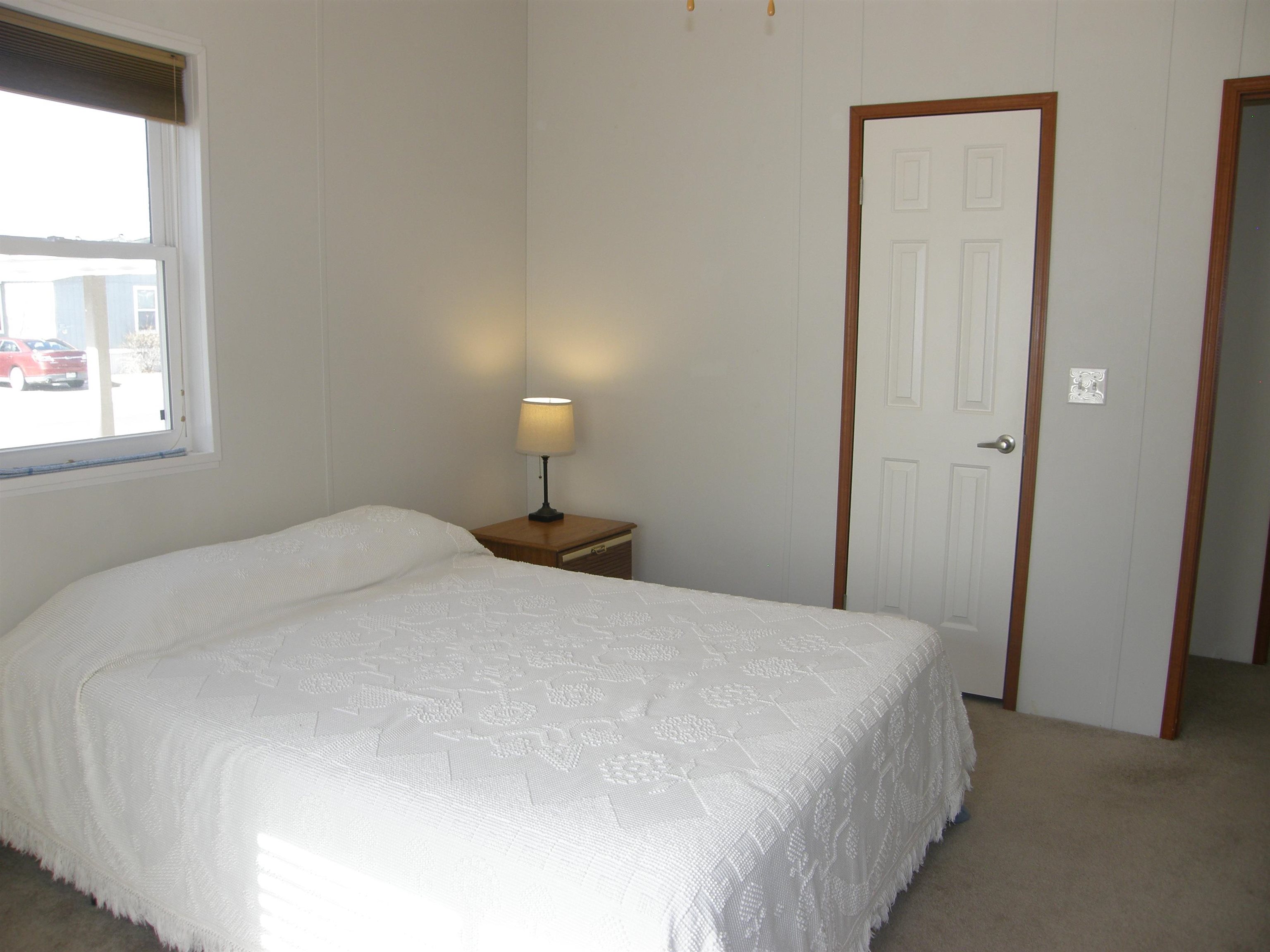 435 32 Road, Unit 262 Clifton, CO 81520 - Photo 38 of 42 a bedroom with a bed and a window