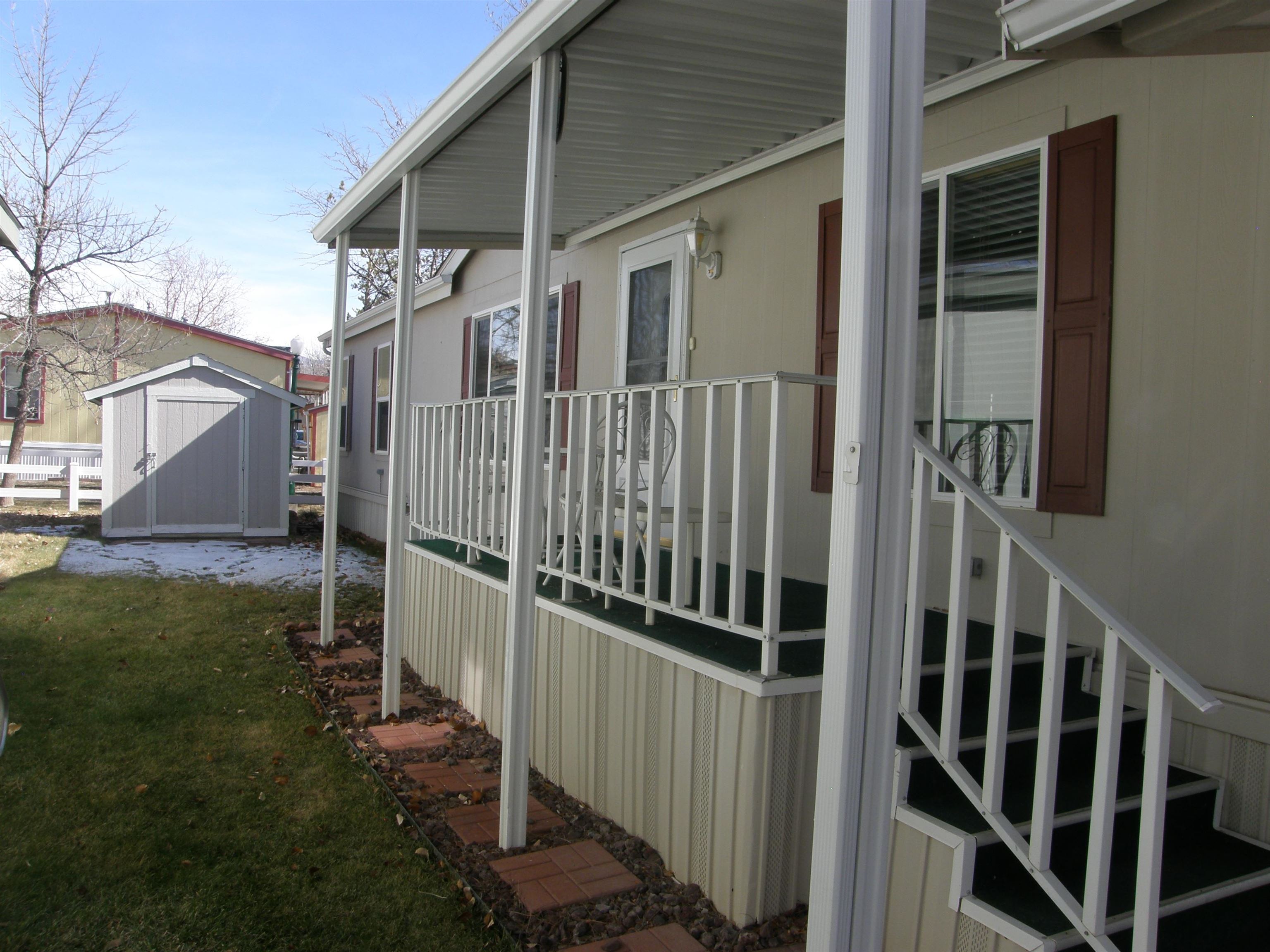 435 32 Road, Unit 262 Clifton, CO 81520 - Photo 5 of 42 a view of a house with backyard and porch