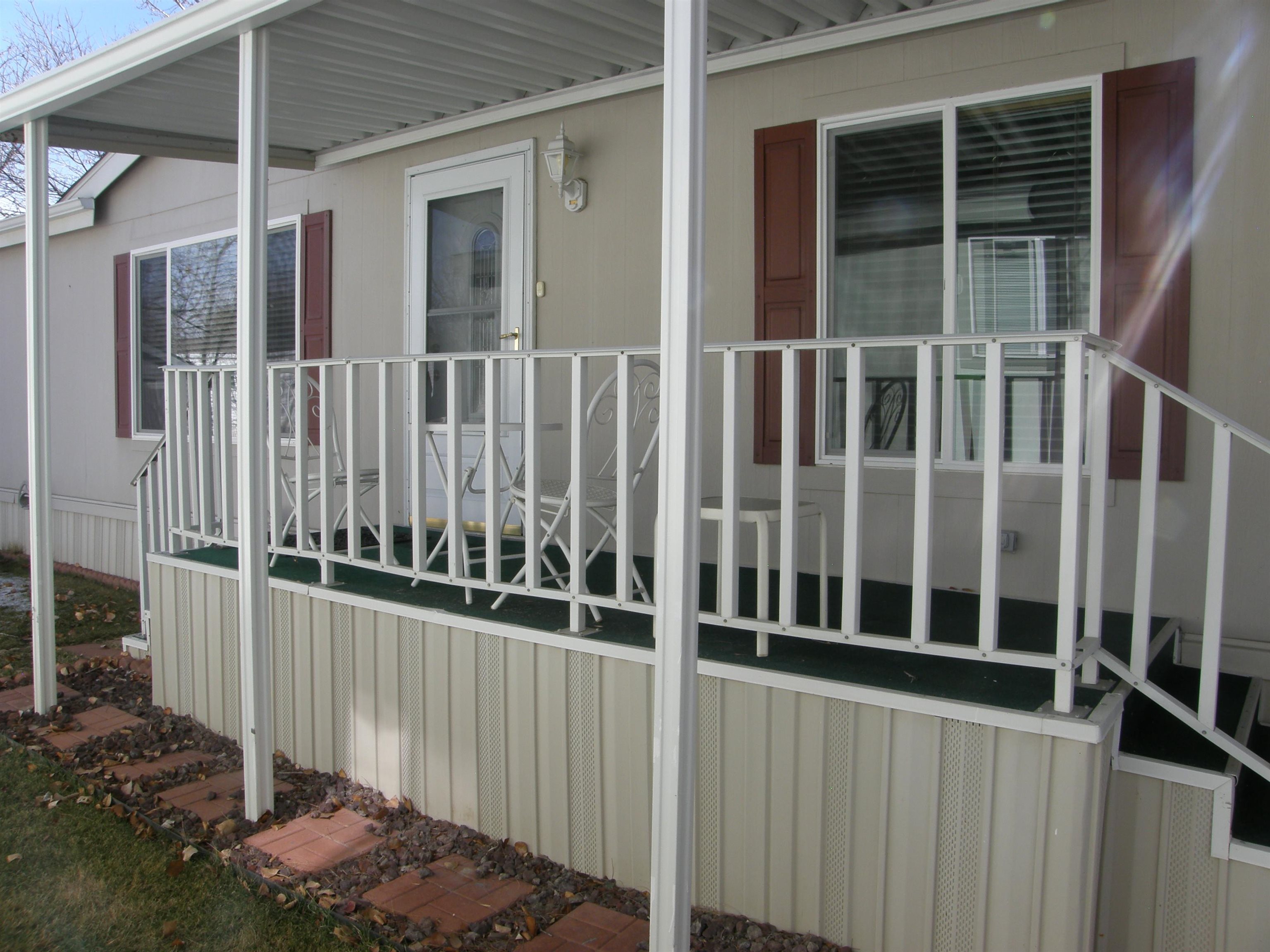 435 32 Road, Unit 262 Clifton, CO 81520 - Photo 9 of 42 a view of a house with wooden fence