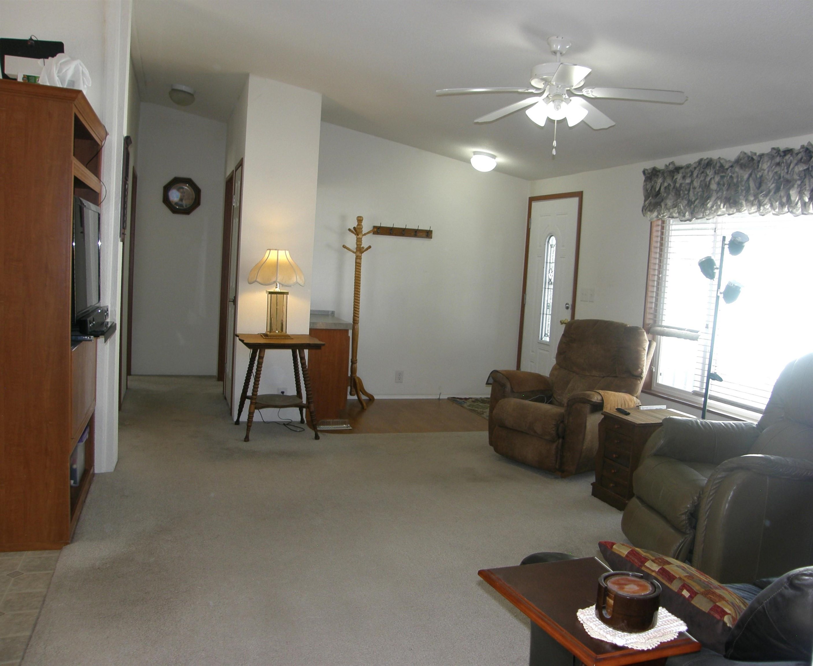 435 32 Road, Unit 262 Clifton, CO 81520 - Photo 10 of 42 a living room with furniture and a chandelier
