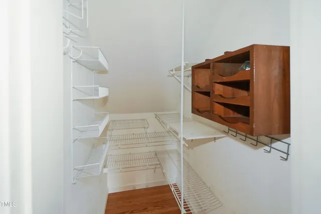 a view of a kitchen with a stove microwave and cabinets
