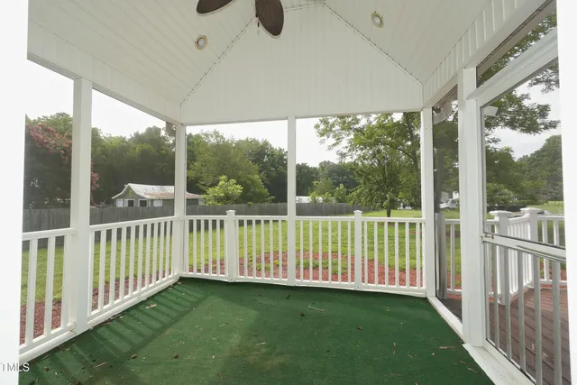 a view of a porch with a yard