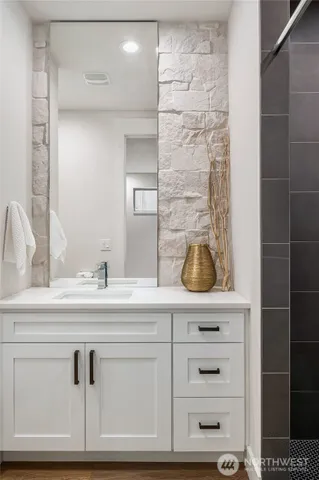 a bathroom with a sink and a mirror