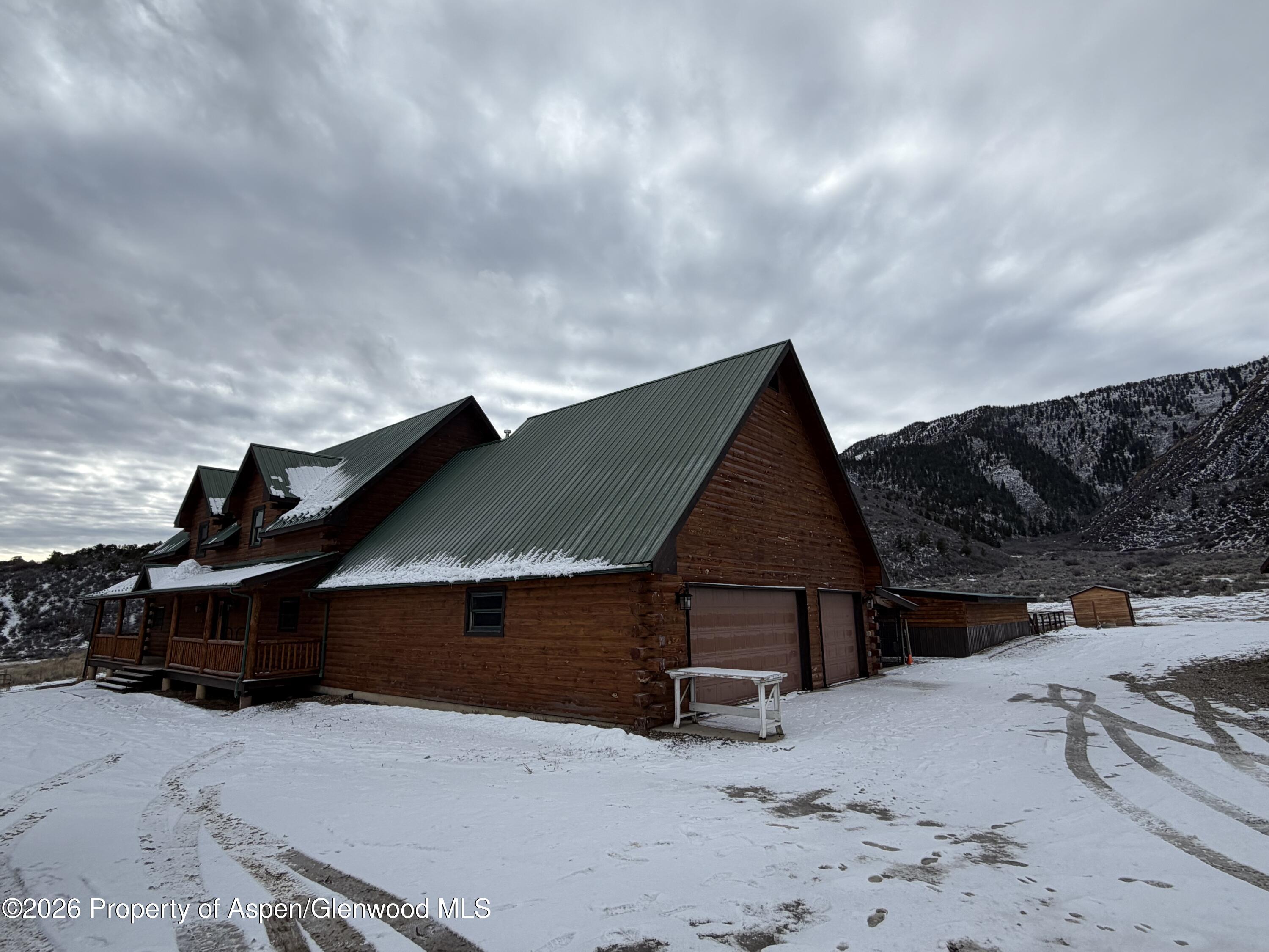 219 Big Dog Road Rifle, CO 81650 - Photo 3 of 11 a view of a house with wooden fence