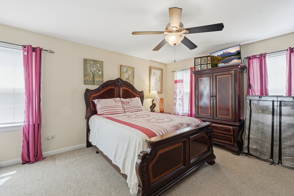 19 Annies Way Springfield, MA 01119 - Photo 15 of 40 a bedroom with a bed and a chandelier