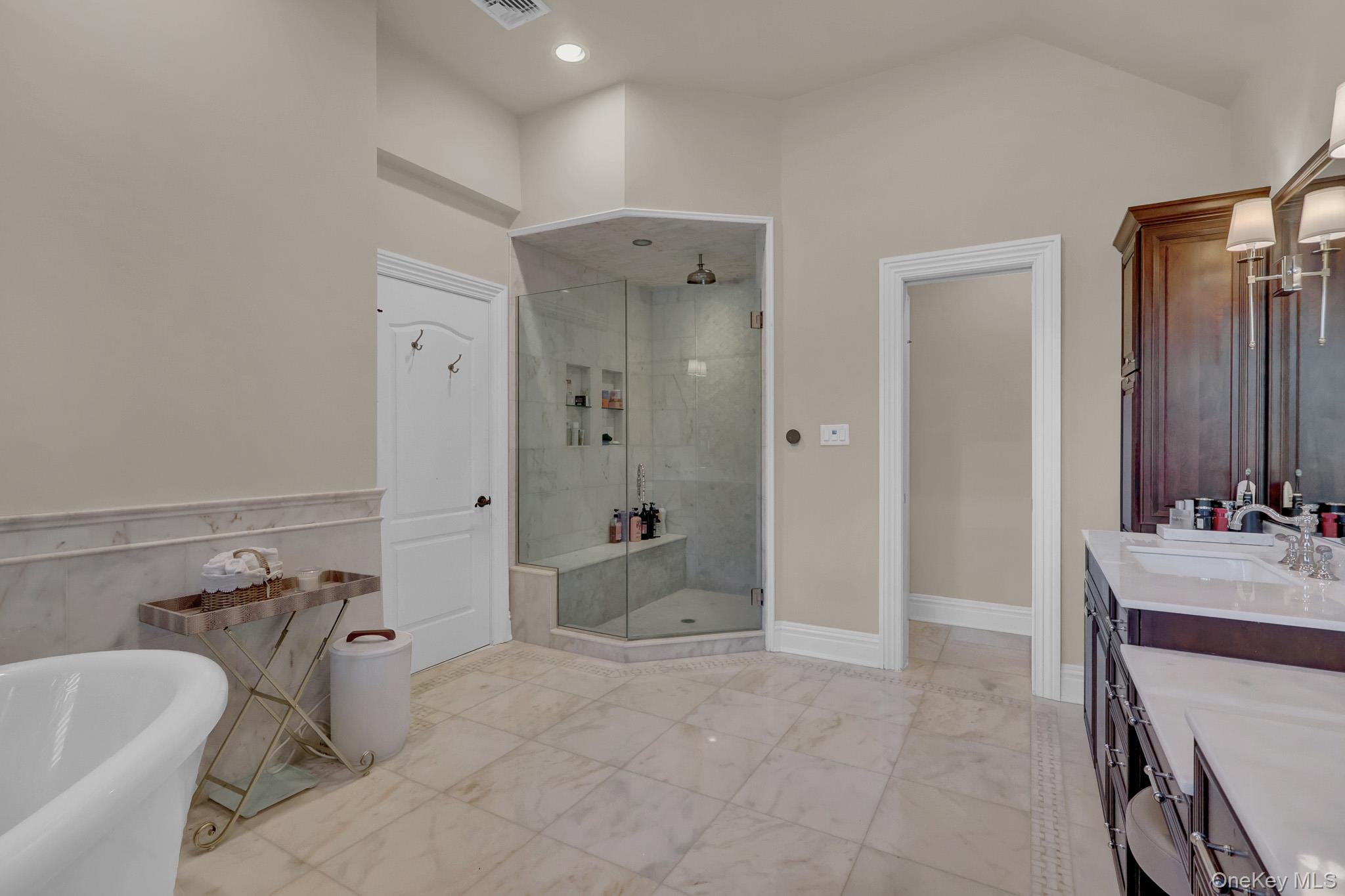 36 Old Field Road Setauket, NY 11733 - Photo 33 of 42 a bathroom with a tub sink and mirror