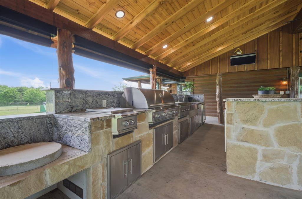 465 Emberson Ranch Road Pilot Point, TX 76258 - Photo 4 of 40 a view of a kitchen with furniture and a kitchen