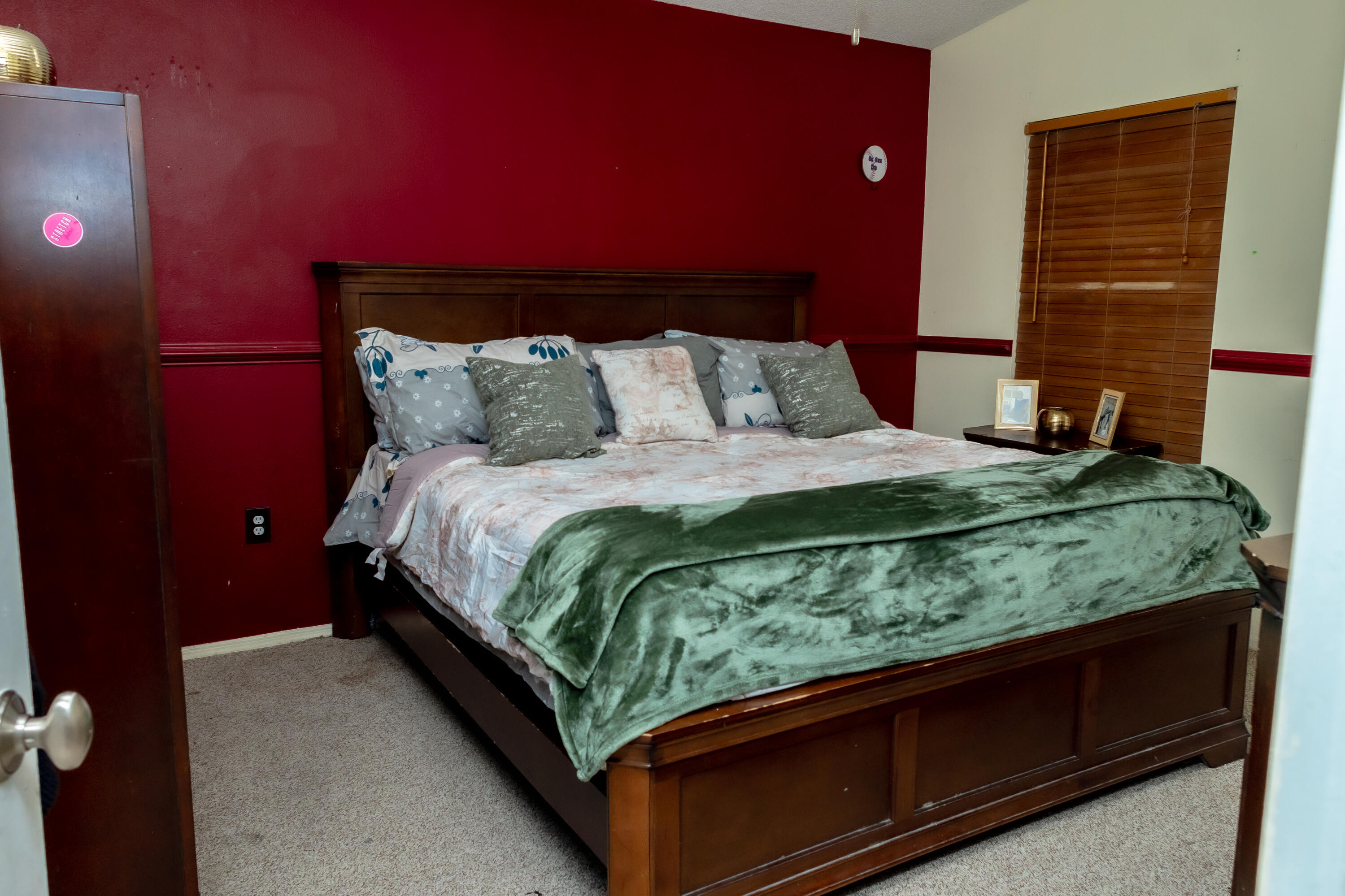 464 Emerald Cove Loop Lakeland, FL 33813 - Photo 15 of 25 a bed sitting in a bedroom next to a window