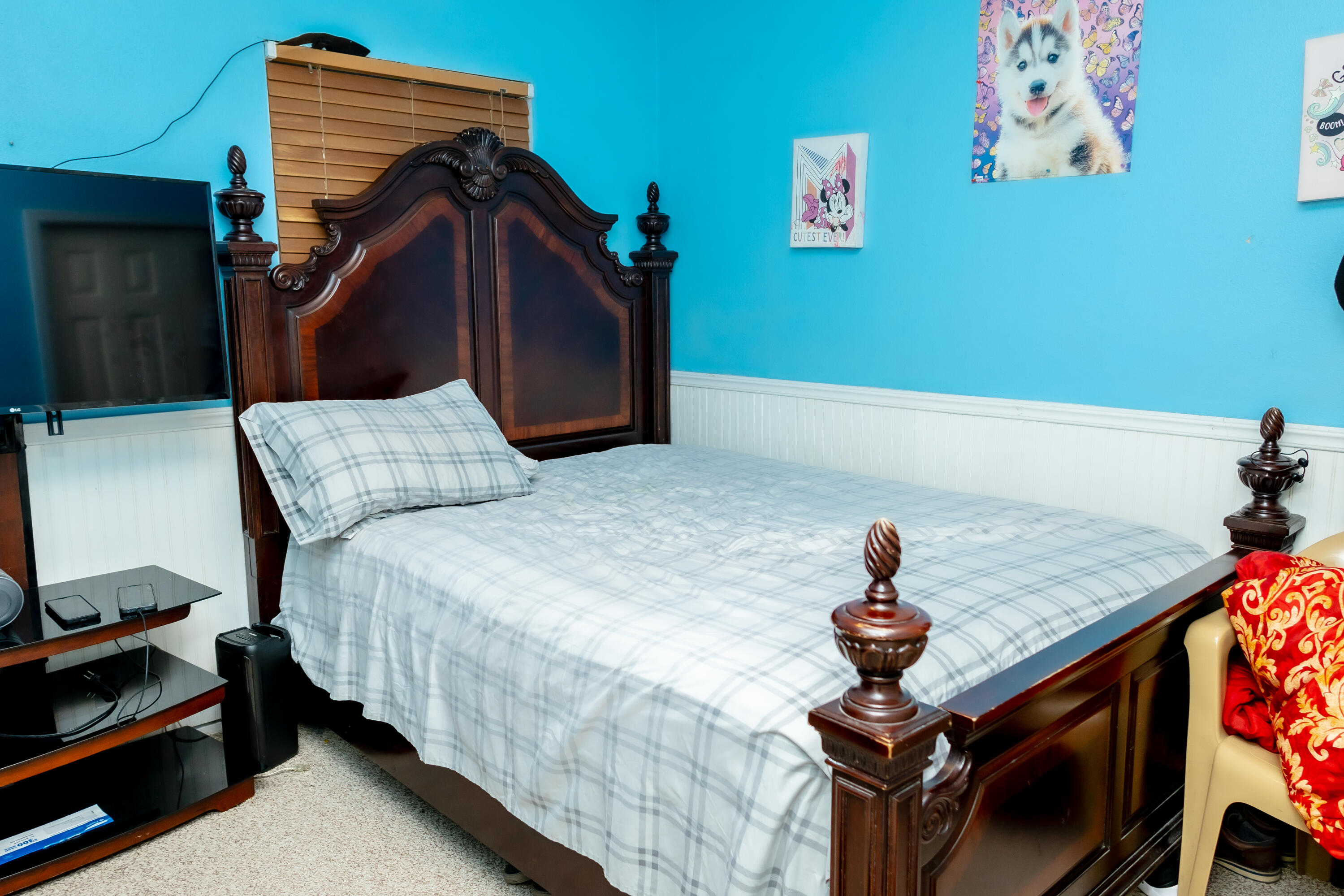 464 Emerald Cove Loop Lakeland, FL 33813 - Photo 17 of 25 a bedroom with a bed and a chandelier