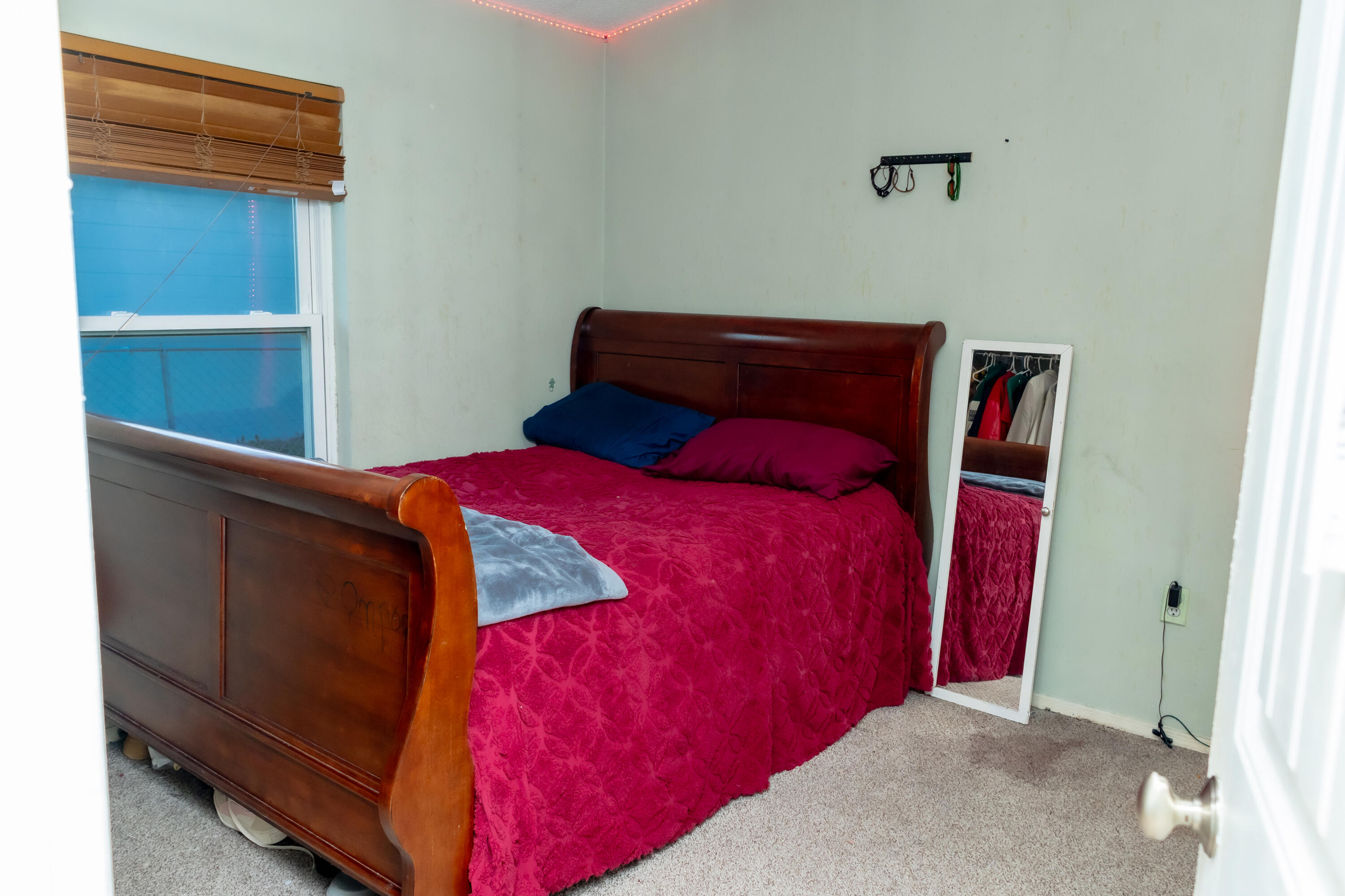 464 Emerald Cove Loop Lakeland, FL 33813 - Photo 18 of 25 a bedroom with a bed and a window