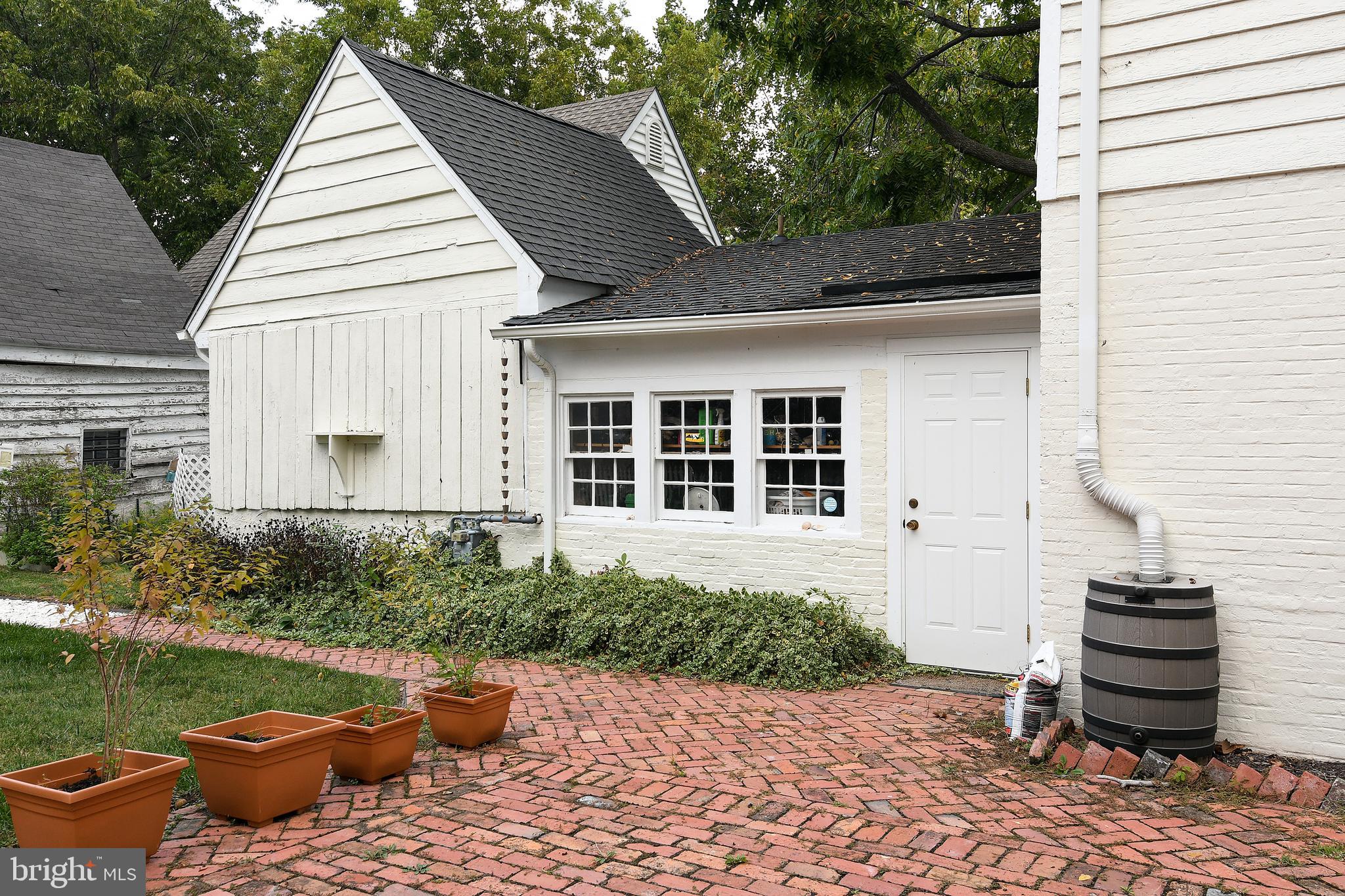 207 High Street Cambridge, MD 21613 - Photo 7 of 44 Utility Room w/ windows Next to Former Smoke House