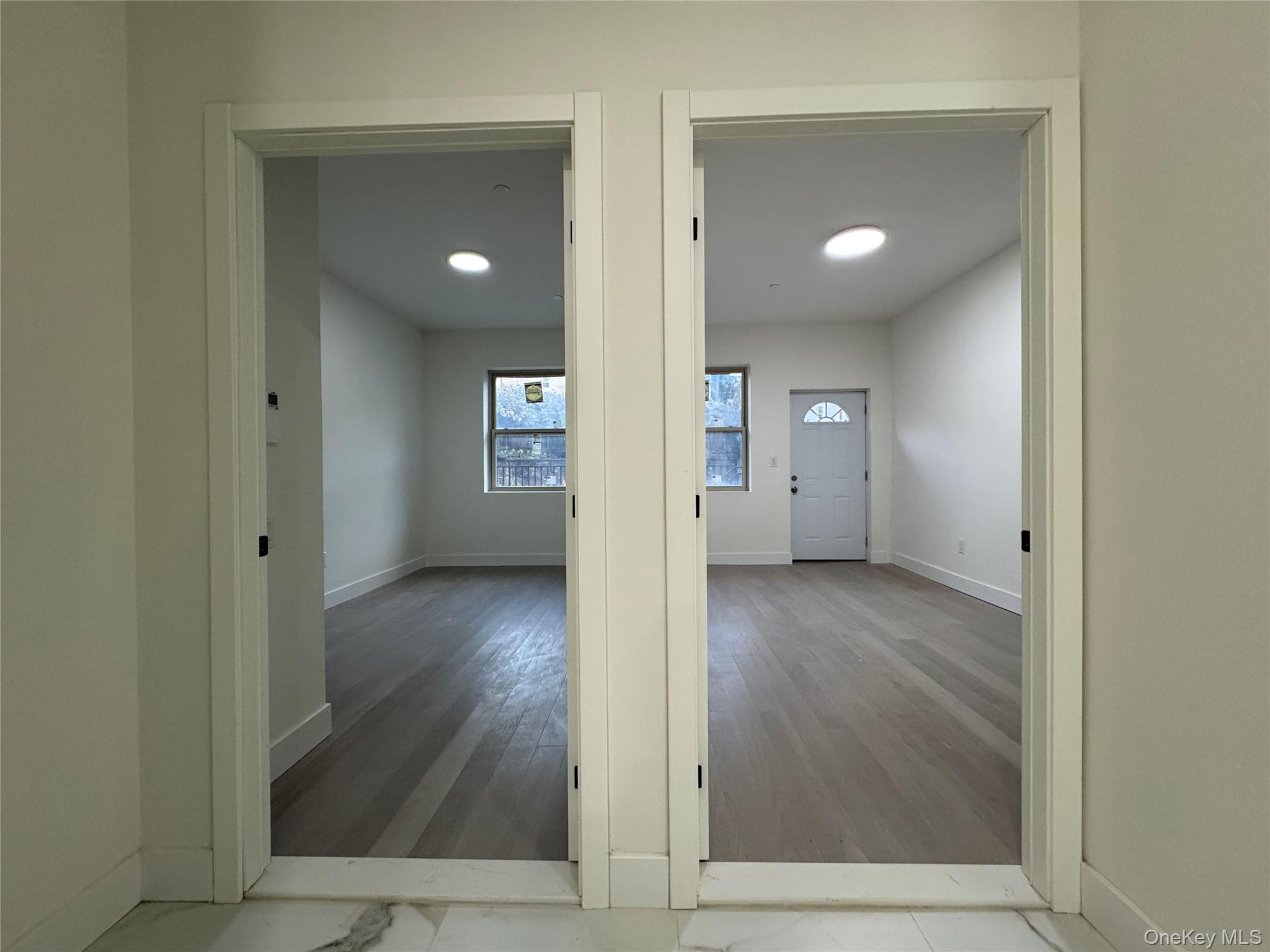 101-12 Martense Avenue Queens, NY 11368 - Photo 5 of 8 a view of hallway with wooden floor