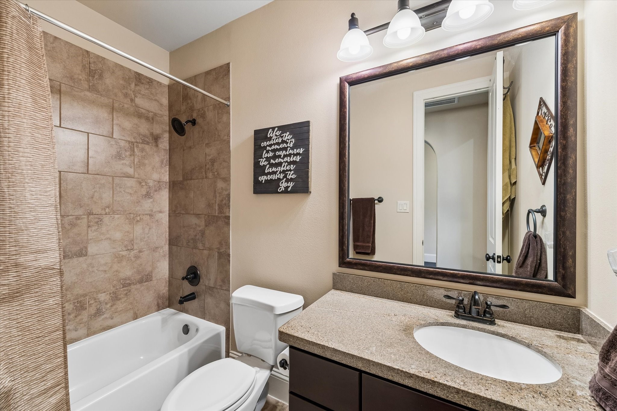3 Tiburon Court Spring, TX 77389 - Photo 21 of 34 Just outside the bedroom door, a full bathroom with timeless finishes allows guests to have their own dedicated space, making extended visits comfortable and effortless.