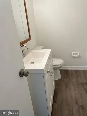 a bathroom with a sink and toilet