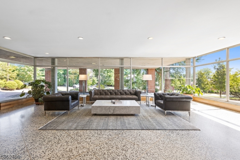 36 Hawthorne Place, Unit 2I Montclair, NJ 07042 - Photo 19 of 23 a living room with furniture and a large window