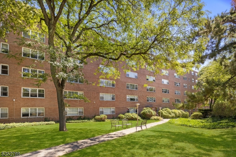 36 Hawthorne Place, Unit 2I Montclair, NJ 07042 - Photo 21 of 23 front view of a building with a yard