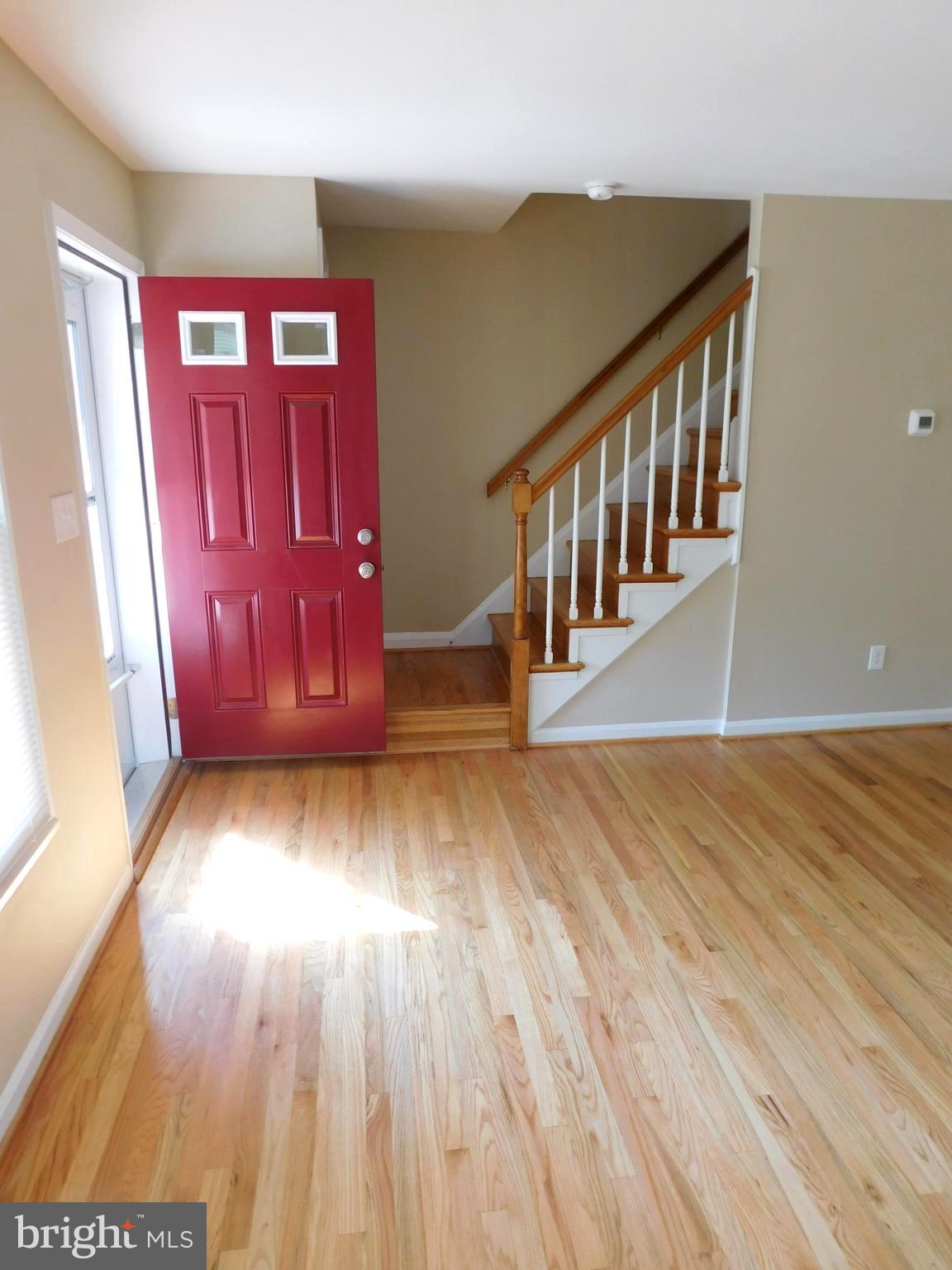 618 Brisbane Road Baltimore, MD 21229 - Photo 5 of 30 a view of a hallway with wooden floor