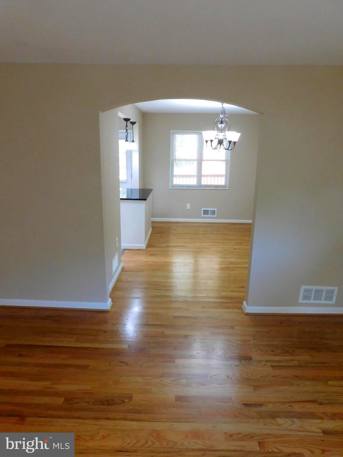 618 Brisbane Road Baltimore, MD 21229 - Photo 8 of 30 a view of a room with wooden floor and window