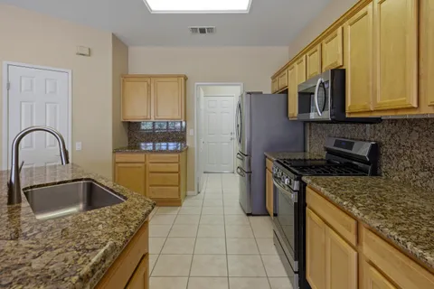 a kitchen with a stove microwave and refrigerator