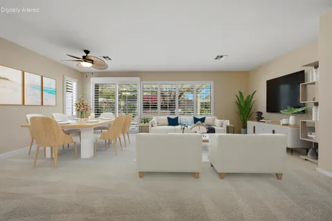 a view of a kitchen with a sink and a refrigerator