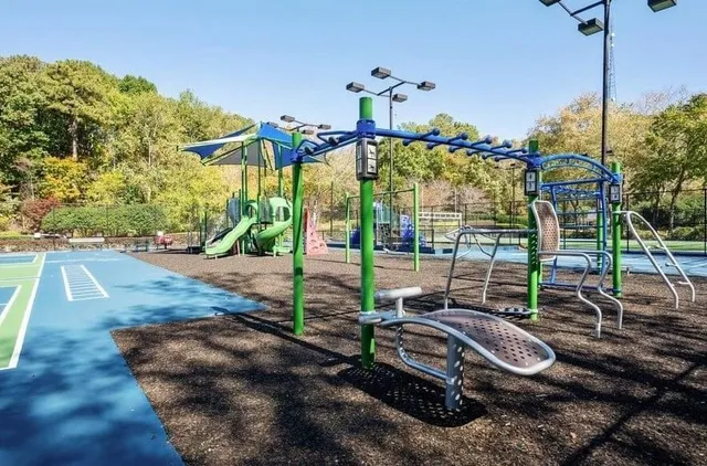 a view of a backyard with sitting area