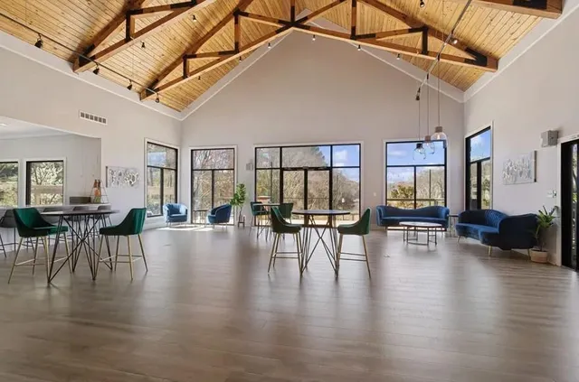 a view of dining room with furniture and wooden floor